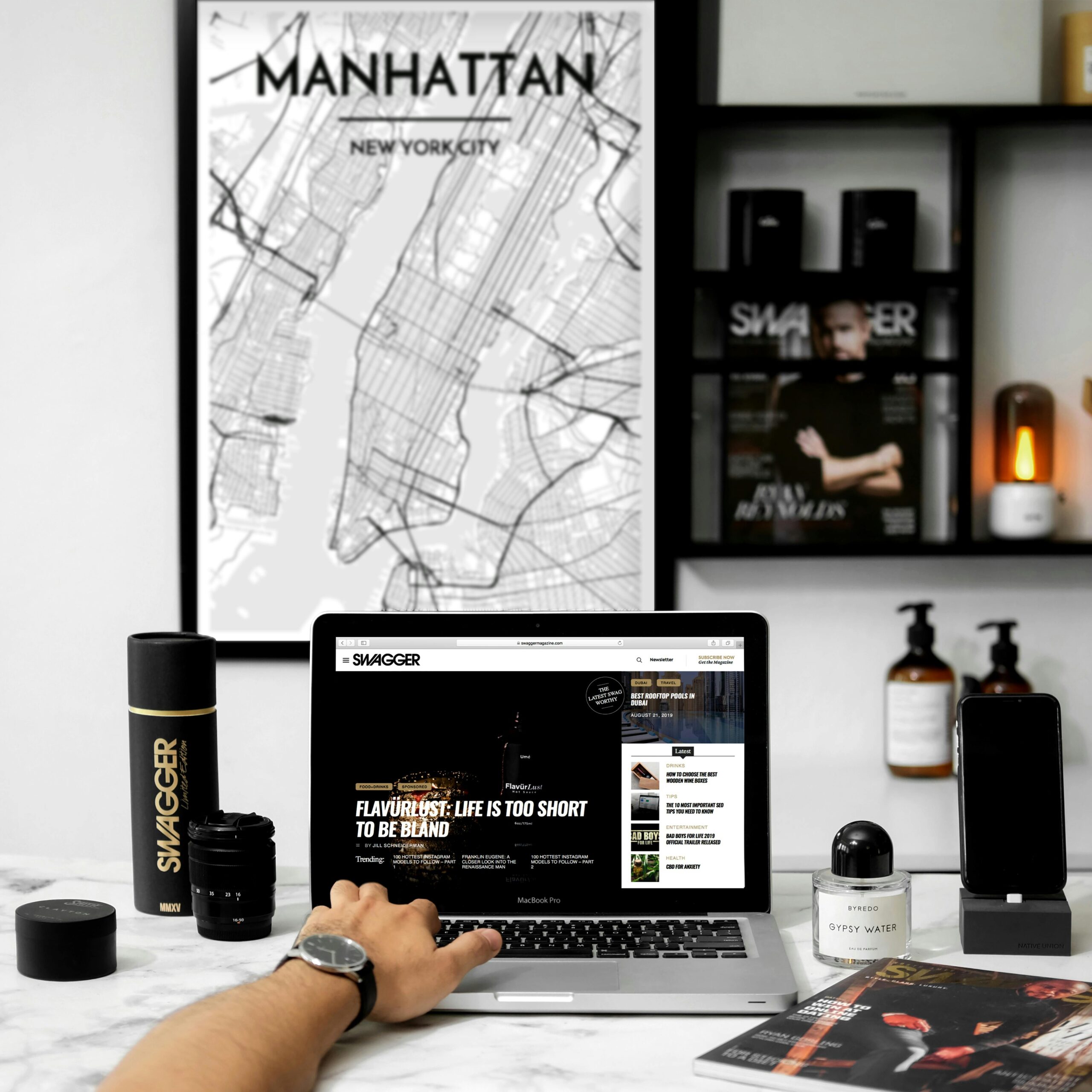 HOME Chic workspace featuring a MacBook, stylish decor, and Manhattan map art.